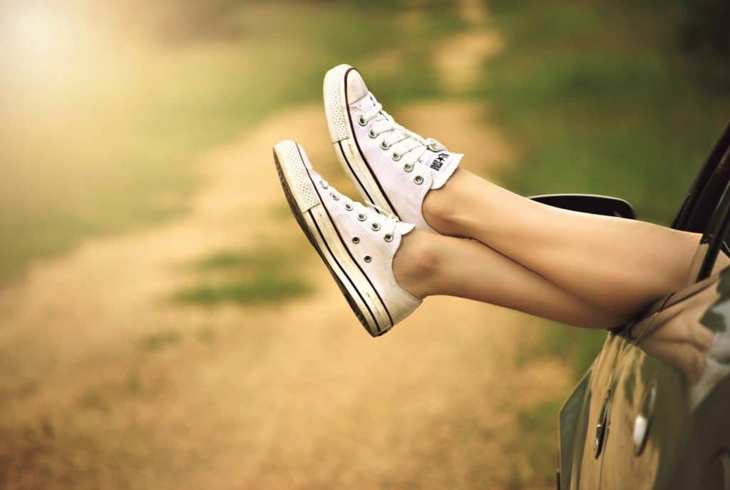 girl relaxing in car. the side hustle will take care of you!