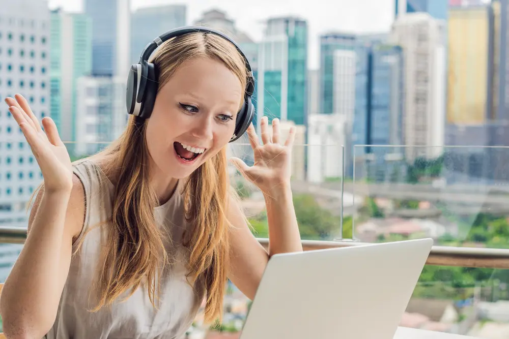 young woman teaching english online, wearing a headset