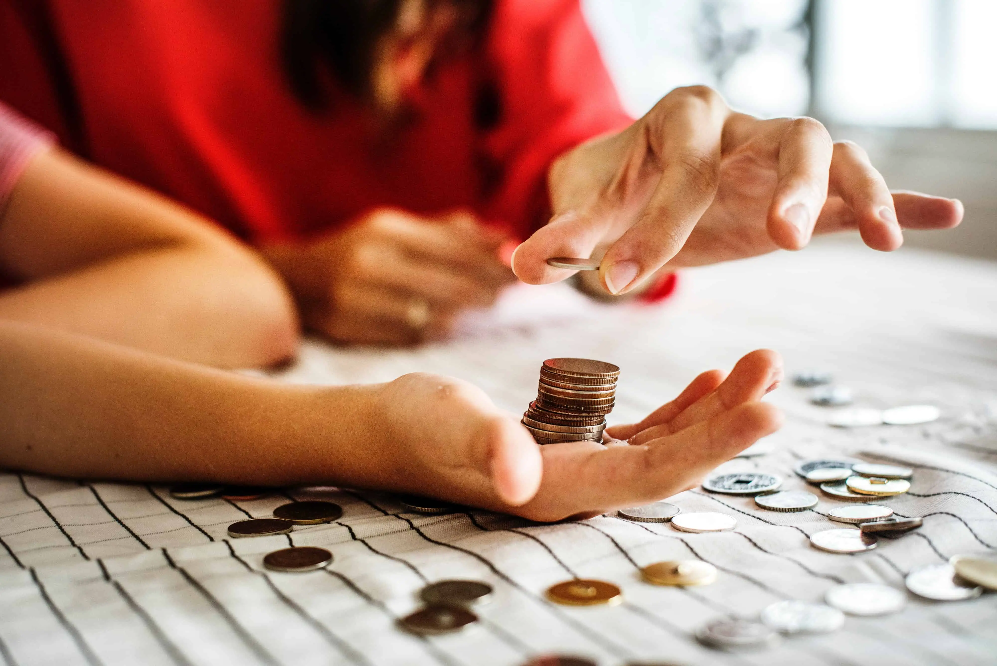 saving for a house - couple counting coins