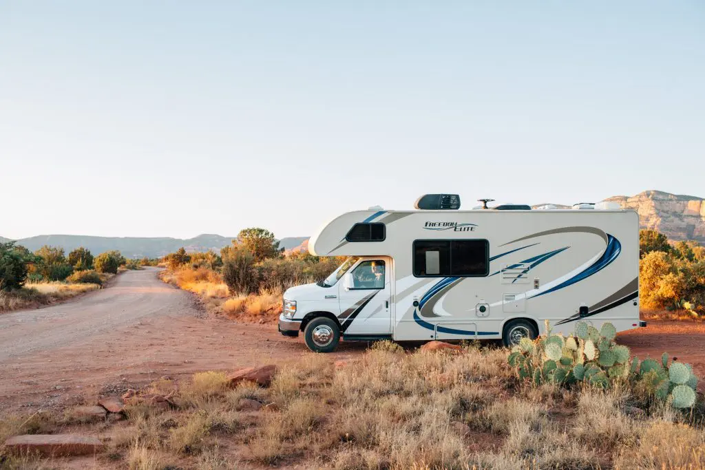 an RV vehicle parked in the desert