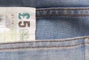 £5 sterling in a Jeans pocket. Get a free £5 here with the Zilgu referral offer.